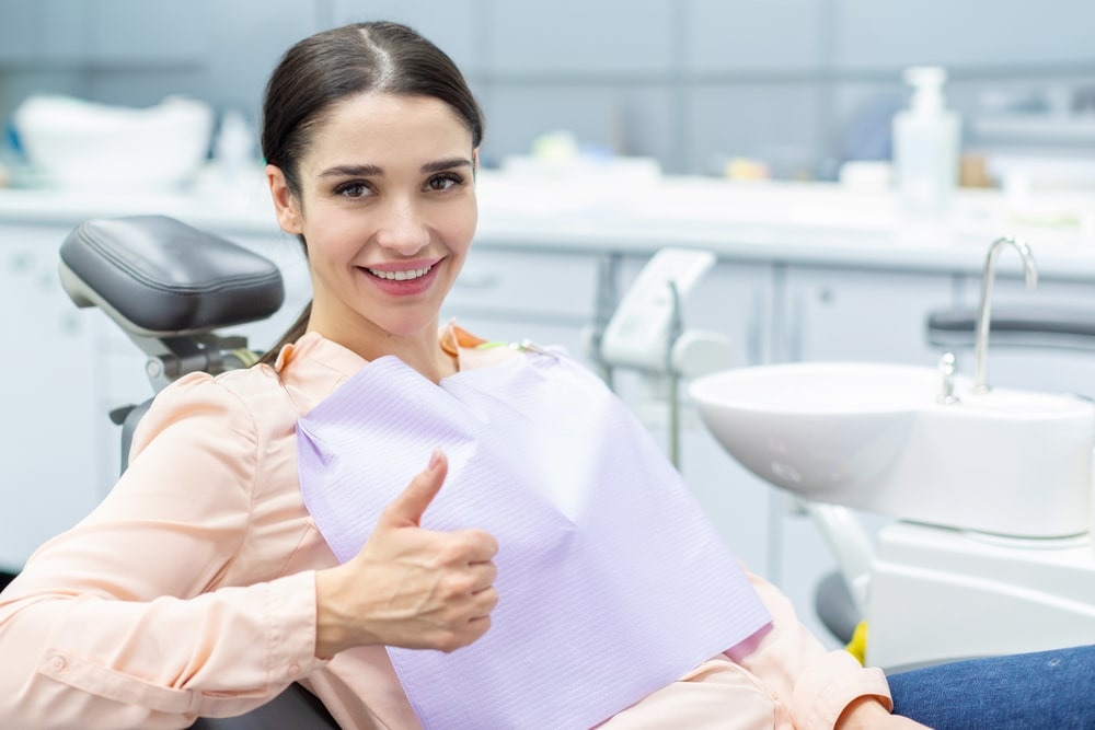 Smiling woman in Spokane after teeth cleaning.